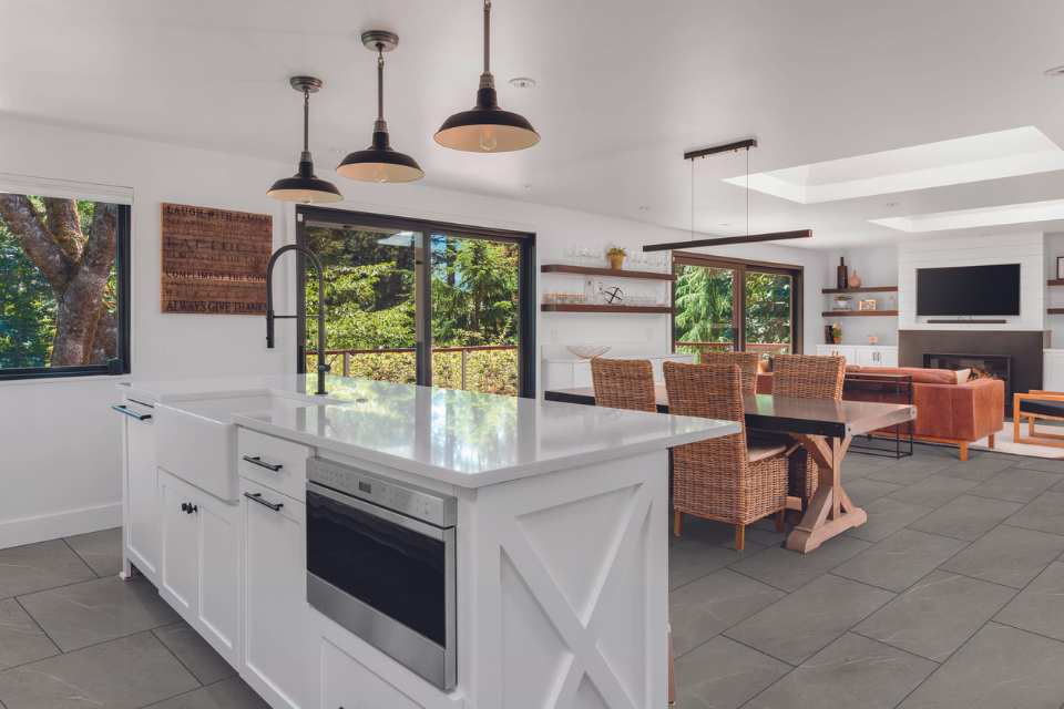 concrete look luxury vinyl tile in modern farmhouse open concept kitchen living
